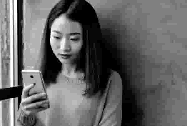 Illustration of person relaxing on phone