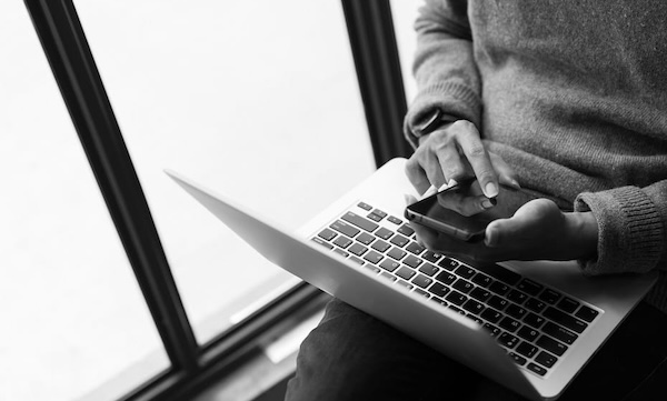 Illustration of person relaxing on phone